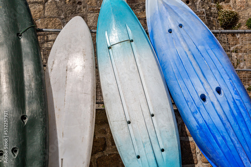 Photography Surf boards standing against a wall waiting to be used