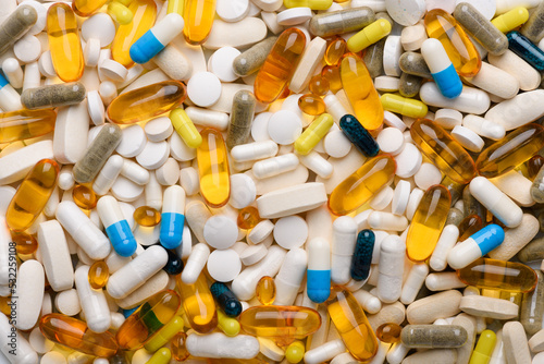 Fotografija Different medication and supplements pills and capsules assortment background te