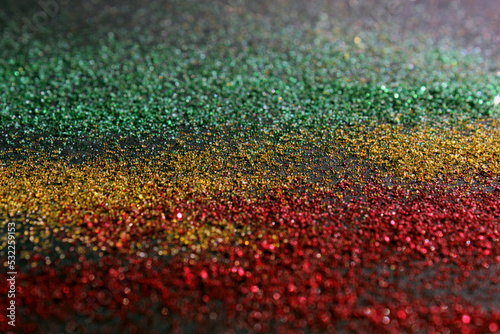 Black History Month concept. Abstract green yellow and red color glitter sparkle background. Space for your text.