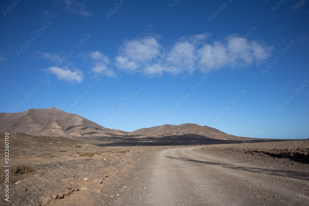 Dusty road and mountains, Lanzarote, Spain