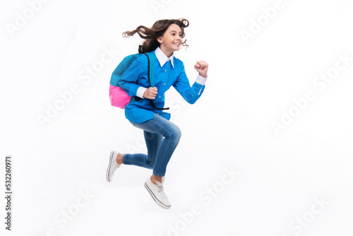 Schoolgirl with backpack. Teenager student, isolated background. Learning and knowledge. Go study. Run and jump. Children education concept. Back to school.