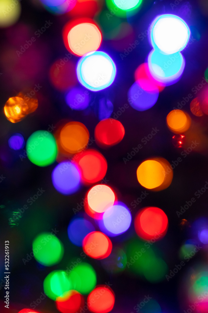 Abstract background with colorful sparkling bokeh on a dark background. Holiday concept Abstract background with colorful sparkling bokeh on a dark background. Holiday concept