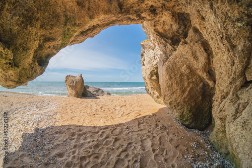 Inside of grotto at day on the sea shore