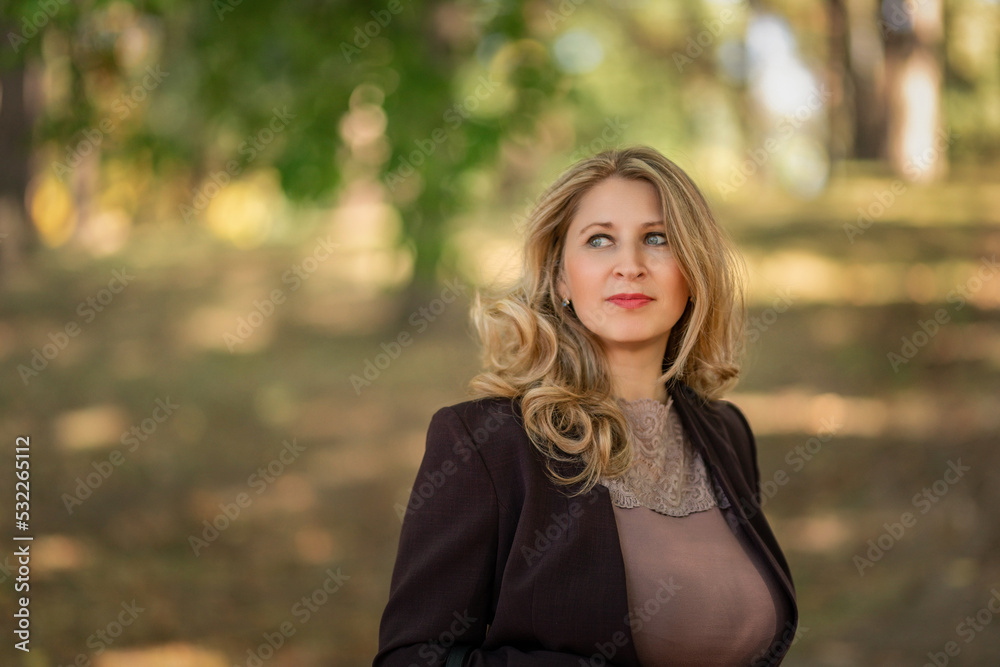 Portrait of a young beautiful fair-haired girl in a summer park. Portrait of a young beautiful fair-haired girl in a summer park.