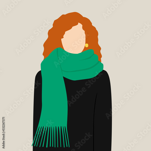 Red-haired girl dressed in a green scarf and coat
