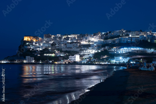 Night view of the town of Peschici from the beach