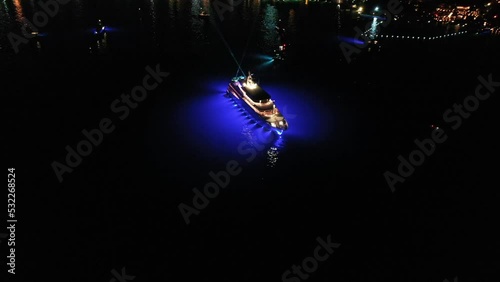 party at a luxury yacht at night, aerial view