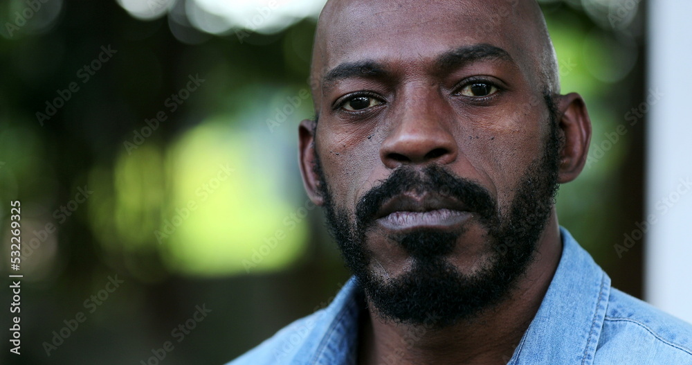 Fototapeta premium Confident black man portrait face close-up. African person