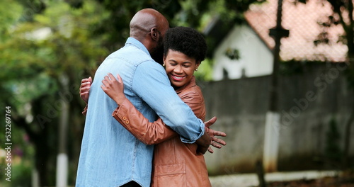 Black couple embrace outside. African people showing love and hug