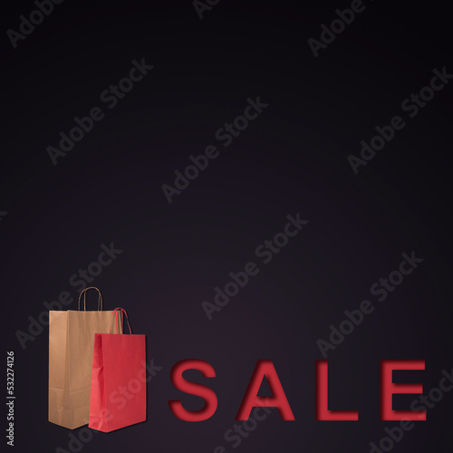 Banner with word sale and shopping bags on black background with copy space