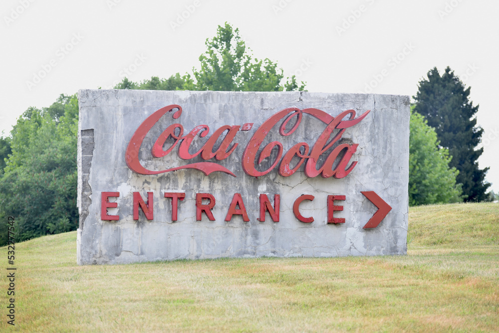 Old sign of Coca Cola headquarters entrance in Lexington, KY in July