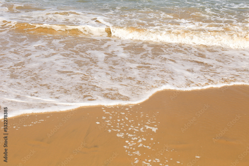 Waves drawing geometric shapes on the shore Waves drawing geometric shapes on the shore