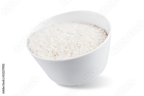 Dried rice in a white bowl on a white isolated background