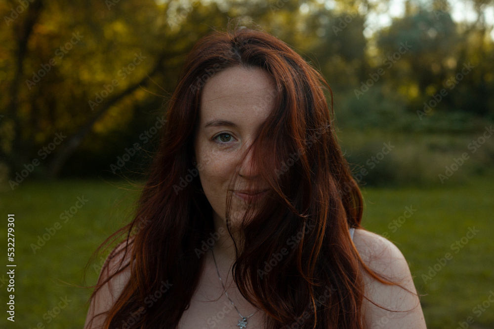beautiful red-haired woman in the middle of the forest beautiful red-haired woman in the middle of the forest