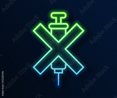 Glowing neon line No doping syringe icon isolated on blue background. Vector