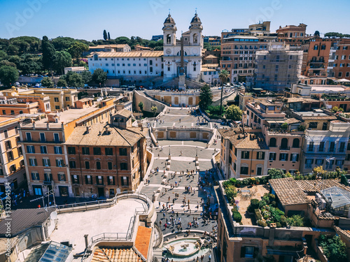 Daytime busy aerial view of Spanish Steps (Piazza di Spagna) in Rome, Italy. Busy touristic place.