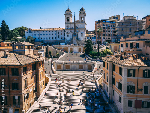 Daytime busy aerial view of Spanish Steps (Piazza di Spagna) in Rome, Italy. Busy touristic place.