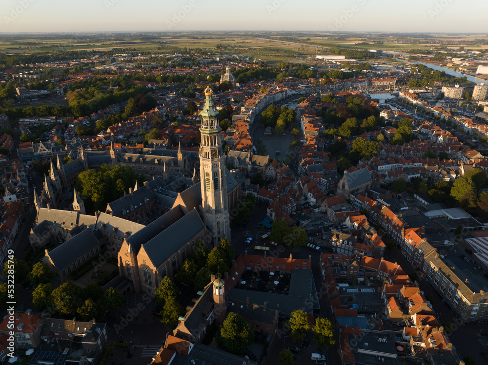 Obraz premium The Abbey Tower 90.5 meter high church tower in the abbey complex in Middelburg. Nicknamed the Lange Jan. Amoung tallest church towers in the Netherlands. Urban city overview in Zeeland Walcheren.