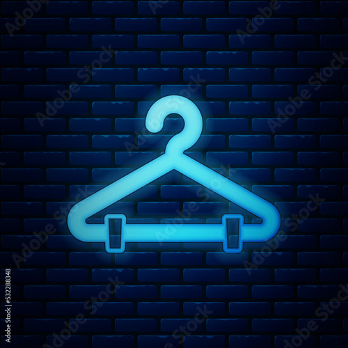 Glowing neon Hanger wardrobe icon isolated on brick wall background. Cloakroom icon. Clothes service symbol. Laundry hanger sign. Vector