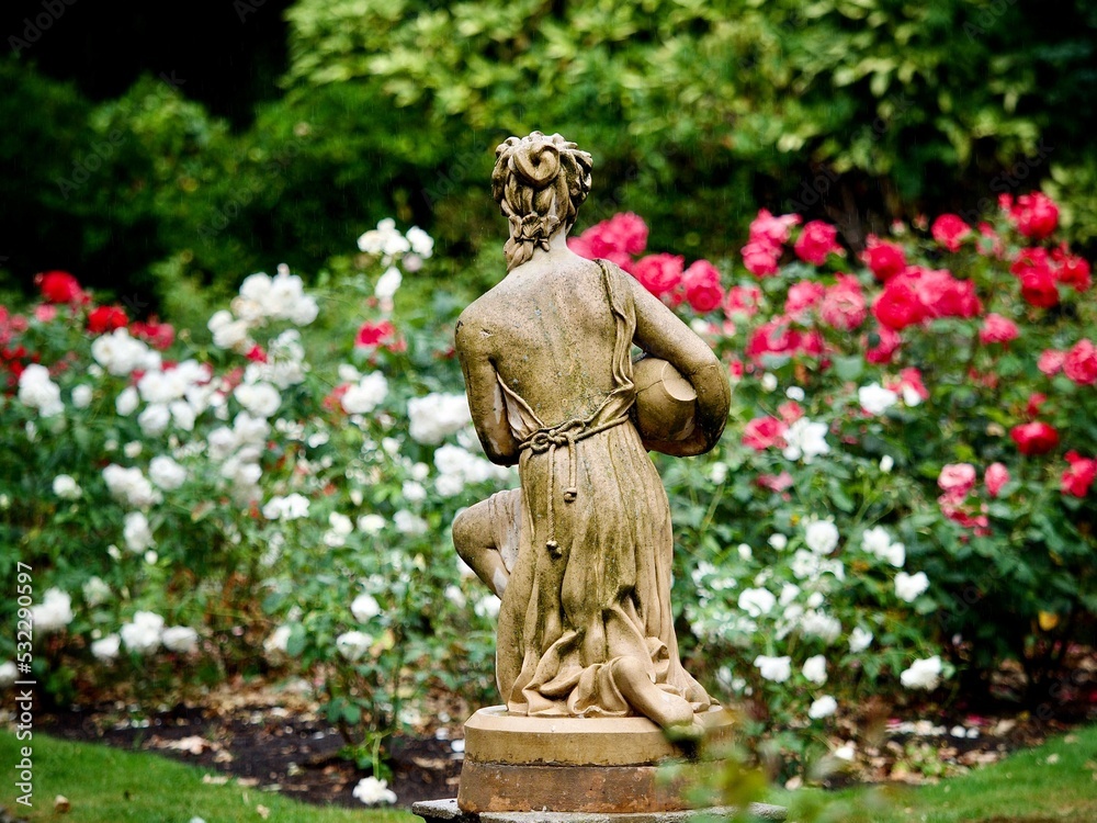 Vintage Garden Statue in a Rose Garden