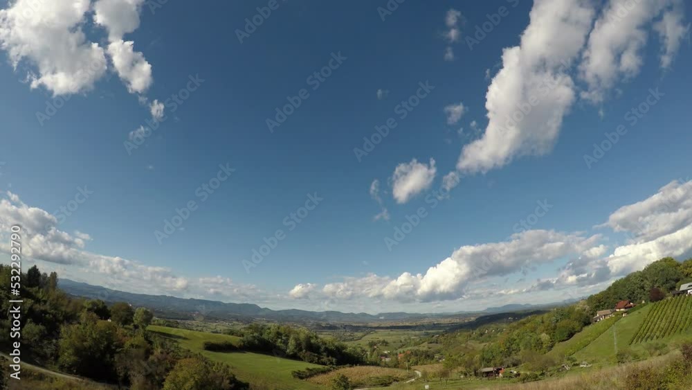 white clouds are floating in the sky, thereby covering the shot at about 300 meters in height, late summer, early afternoon, central Europe, hilly area, time lapse white clouds are floating in the sky, thereby covering the shot at about 300 meters in height, late summer, early afternoon, central Europe, hilly area, time lapse