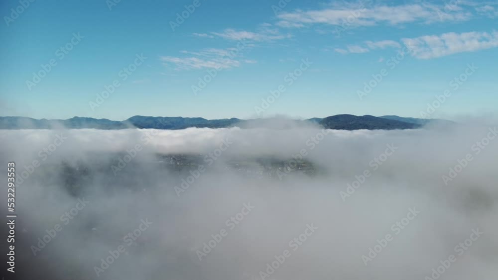 above the white clouds, hilly area, drone shot at about 450 meters, late summer, clouds, fog above the white clouds, hilly area, drone shot at about 450 meters, late summer, clouds, fog