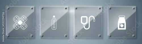 Set Medicine bottle and pills, IV bag, Medical thermometer and Crossed bandage plaster. Square glass panels. Vector