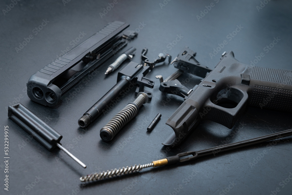Firearms, disassembled gun for cleaning. Firearms, disassembled gun for cleaning.