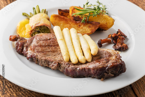 grilled steak with white asparagus