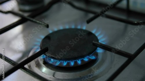 Methan gas kitchen stove closeup while burning,not renewable energy supplies costs crisis