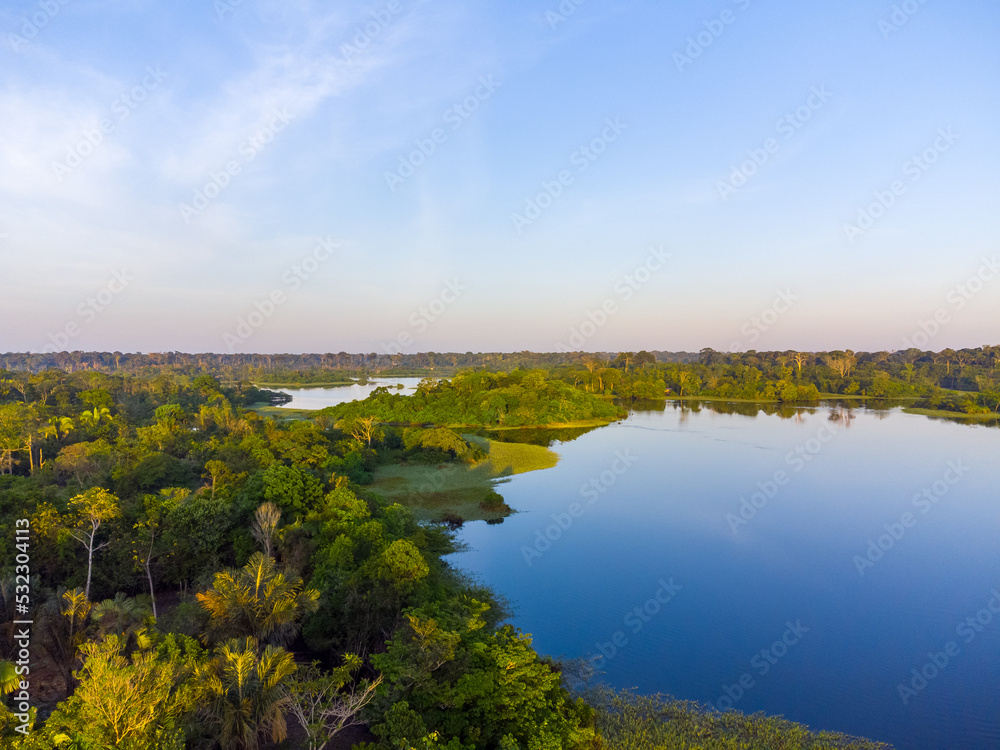 Obraz premium Aerial view of Igapó, the Amazon rainforest in Brazil, an incredible green landscape with lots of water and untouched nature at sunset time
