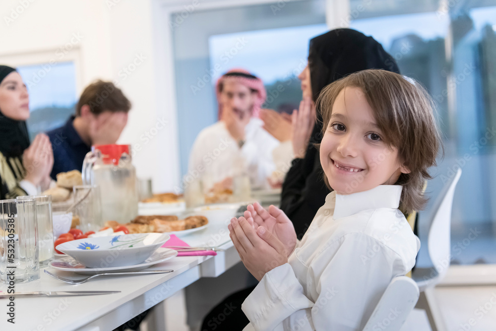 Muslim family making iftar dua to break fasting during Ramadan. Muslim family making iftar dua to break fasting during Ramadan.