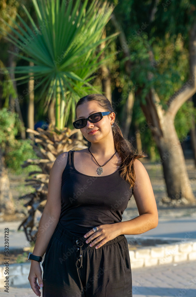 Portrait of a young beautiful girl on a sunny day