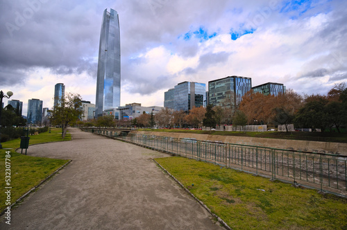 Cityscape during grey winter day, Santiago, Chile. Costanera skycraper on background, Mapocho river at first ground photo