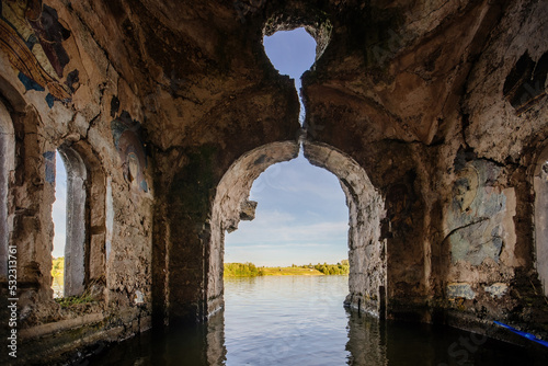 Large flooded hall of ruined abandoned church