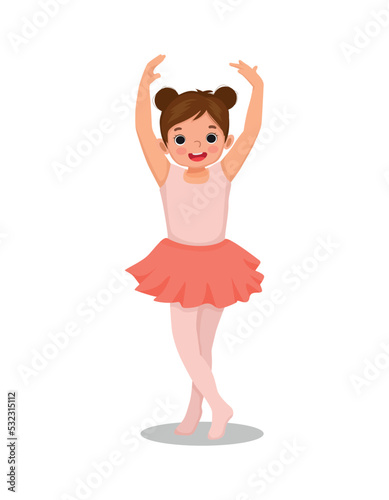 Cute little girl  ballerina practicing ballet dancing in the room
