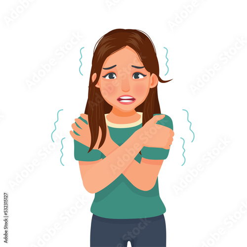 young woman trembling feeling cold hugging herself 