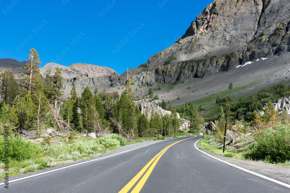 Scenic Highway 108 road running through Sierra Nevada mountain scenery on a sunny summer day in summer near Sonora Pass Scenic Highway 108 road running through Sierra Nevada mountain scenery on a sunny summer day in summer near Sonora Pass