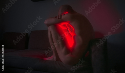Depressive Naked Glowing Person At Home photo