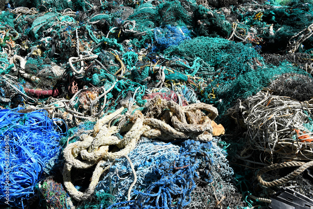 A large pile of trawler fishing nets, ropes and debris dredged up from the  Port of Los Angeles. Fishing nets are a major source of ocean pollution.