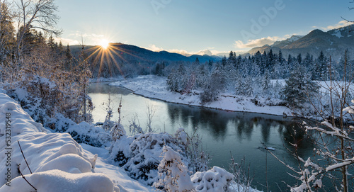 River Isar near Lenggries after heavy snowfall at sunset, view towards Jachenau valley. Germany, Bavaria photo