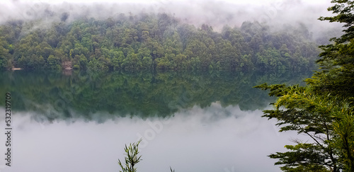 Huerquehue National Park. Lake in the mists of winter.  photo