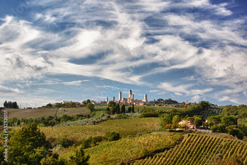 Italy, Tuscany, San Gimignano. The walled medieval hill town of San Gimignano surrounded by vineyards.