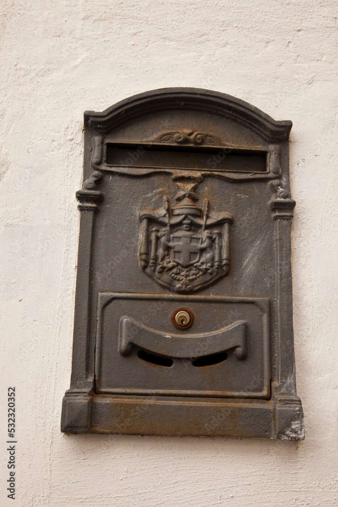 Italy, Tuscany. Old Italian letter box on the wall of a home.