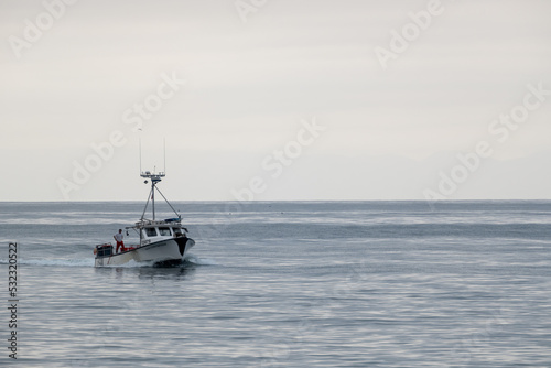 Fisherman Stands On The Back Of Troller