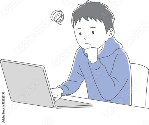 パソコンで勉強をする困った表情の男子学生