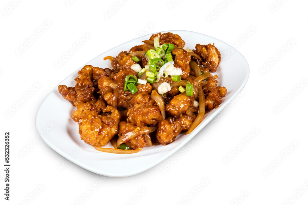 Chinese and oriental dish Chili Chicken  garnished with green onions on a white plate isolated on white