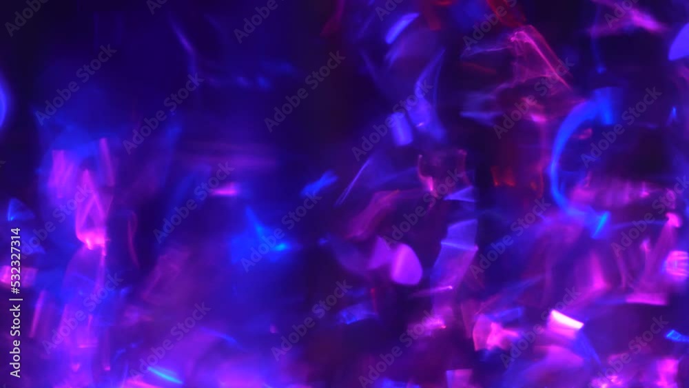 Blue and neon purple bokeh digital background. Psychedelic abstract random movement of lights and glare on a dark background