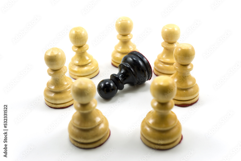 a group of white chess pawns make a circle in the middle there is a black a group of white chess pawns make a circle in the middle there is a black