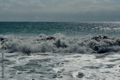 Wave breaking on Los Frailes beach in Machalilla National Park outside of Puerto Lopez, Ecuador